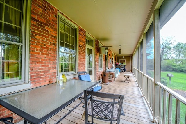 sunroom with outdoor dining space