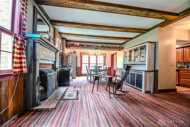interior space featuring an inviting chandelier and beam ceiling