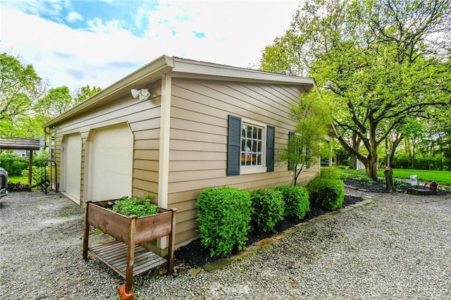 view of property exterior featuring an outdoor structure