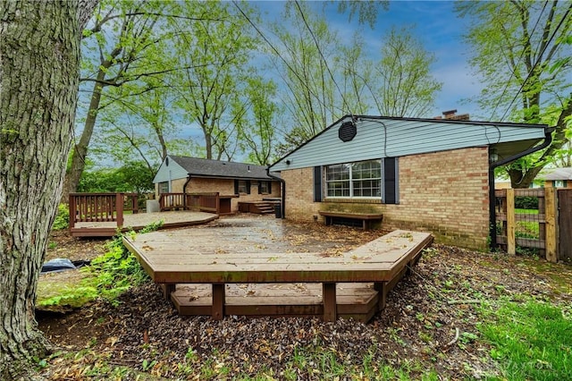 wooden deck featuring fence