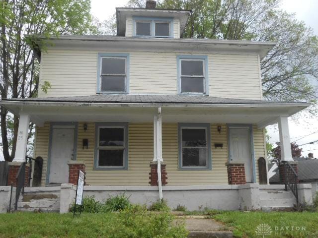 traditional style home featuring a porch