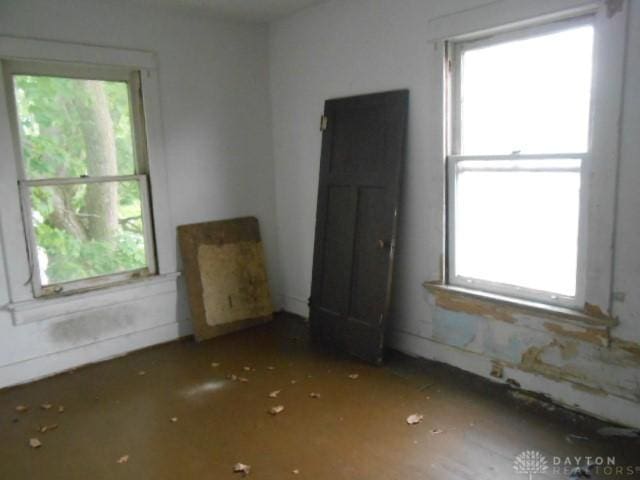 unfurnished room featuring plenty of natural light