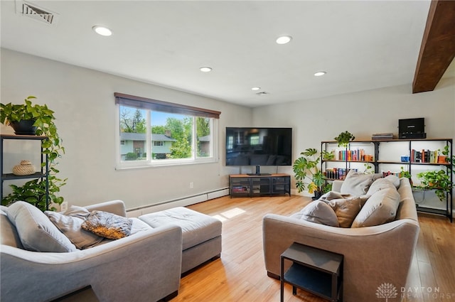 living room with visible vents, recessed lighting, light wood-style flooring, and baseboard heating