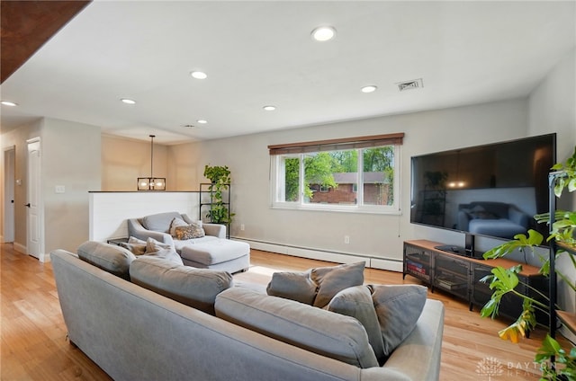 living area with an inviting chandelier, baseboard heating, light wood-style flooring, recessed lighting, and visible vents