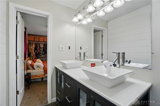 full bath with a sink and double vanity