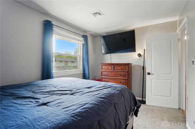 bedroom featuring carpet floors and visible vents