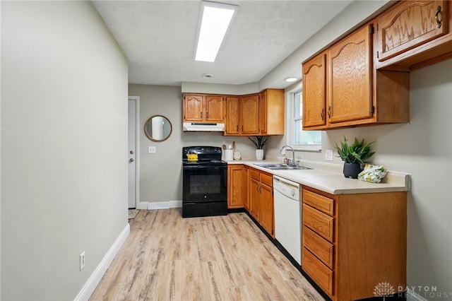 59 Janet Ave, Carlisle, OH 45005 - kitchen with brown cabinets, a sink, light wood-style floors, dishwasher, and black / electric stove