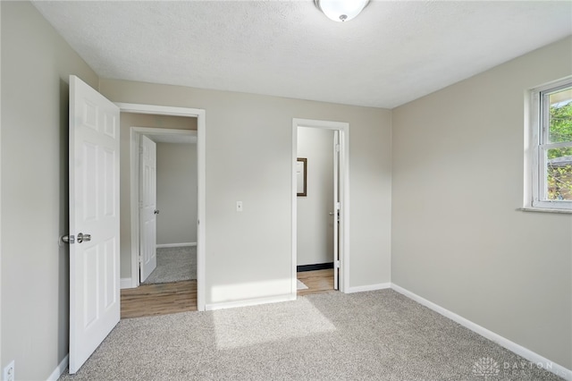 59 Janet Ave, Carlisle, OH 45005 - unfurnished bedroom with carpet floors and baseboards
