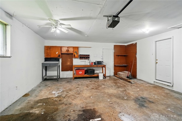 59 Janet Ave, Carlisle, OH 45005 - garage with a workshop area, a garage door opener, and a ceiling fan