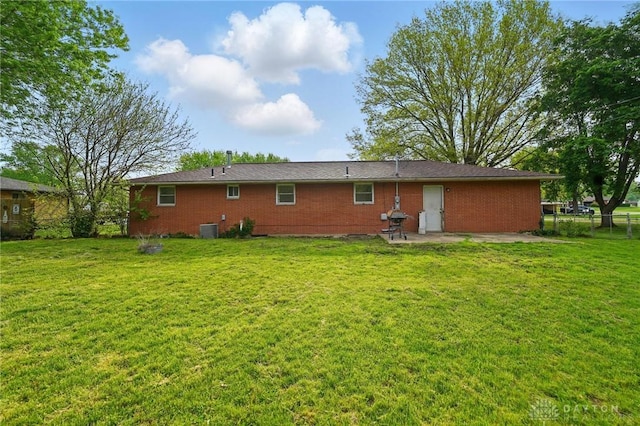 59 Janet Ave, Carlisle, OH 45005 - back of property featuring a patio area, central AC, and a yard