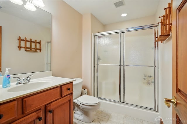 bathroom with visible vents, vanity, toilet, recessed lighting, and a stall shower