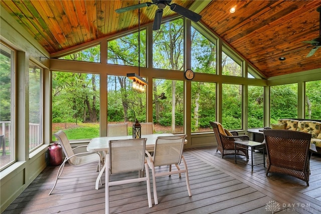 sunroom / solarium with outdoor dining area, ceiling fan, and a healthy amount of sunlight