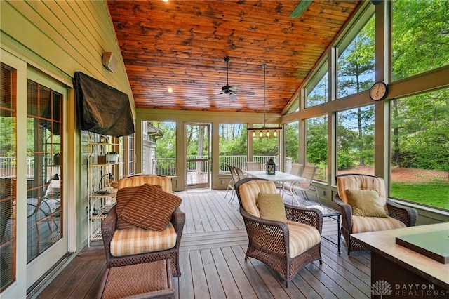 sunroom / solarium featuring ceiling fan