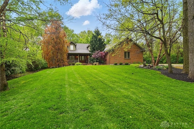 view of yard with covered porch