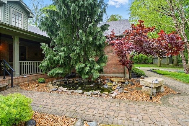 exterior space with brick siding