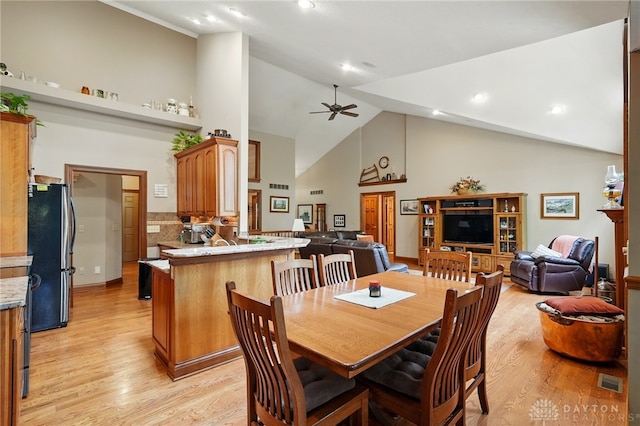 dining area with ceiling fan, visible vents, high vaulted ceiling, light wood finished floors, and recessed lighting
