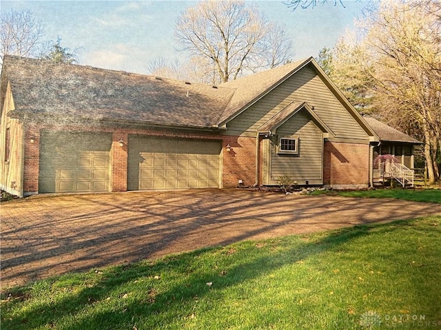 view of front of property featuring a garage, dirt driveway, a front lawn, and brick siding