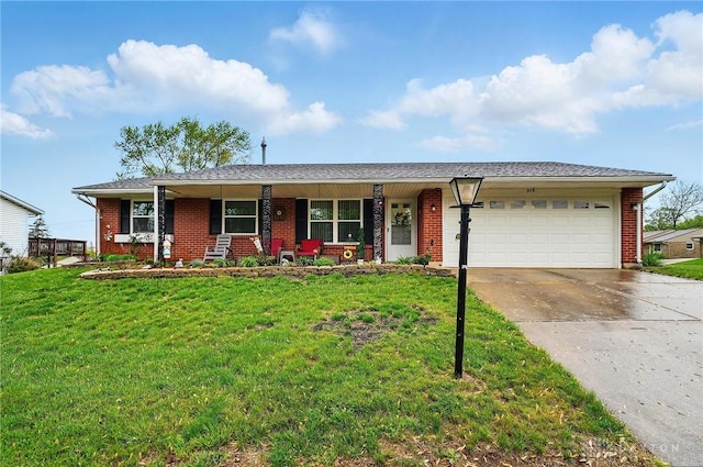 317 Ironwood Dr, West Carrollton, OH 45449 - single story home featuring brick siding, a porch, a garage, and concrete driveway