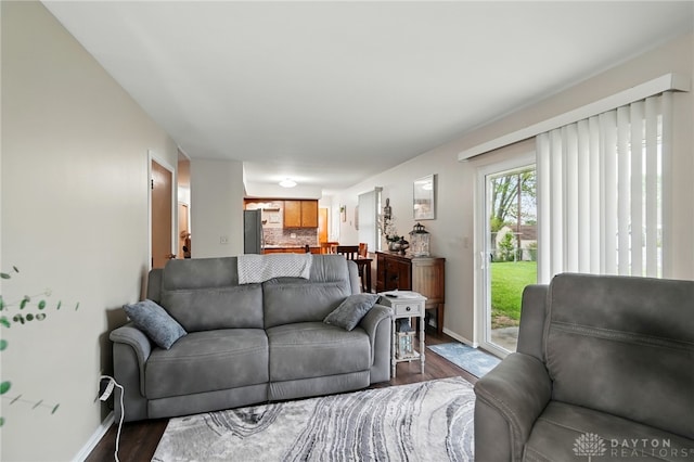 317 Ironwood Dr, West Carrollton, OH 45449 - living area featuring dark wood-style flooring and baseboards