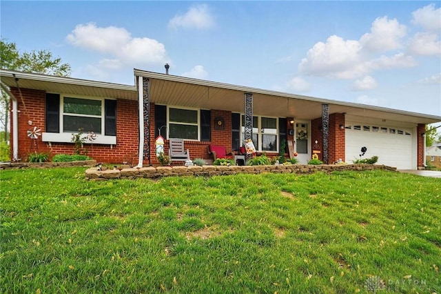 317 Ironwood Dr, West Carrollton, OH 45449 - ranch-style house featuring brick siding, a front yard, an attached garage, and a porch