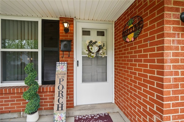 317 Ironwood Dr, West Carrollton, OH 45449 - view of exterior entry with brick siding and covered porch