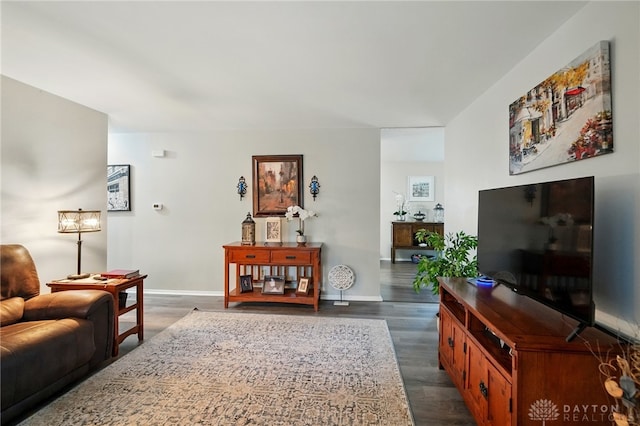 317 Ironwood Dr, West Carrollton, OH 45449 - living room featuring dark wood-type flooring and baseboards