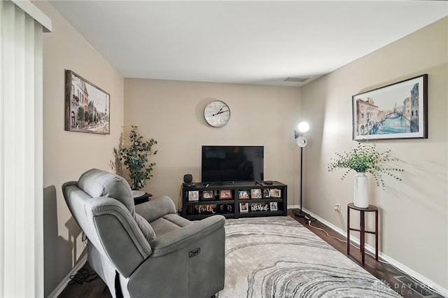 317 Ironwood Dr, West Carrollton, OH 45449 - living room featuring baseboards and dark wood finished floors