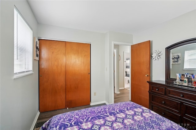 317 Ironwood Dr, West Carrollton, OH 45449 - bedroom with a closet, wood finished floors, and baseboards