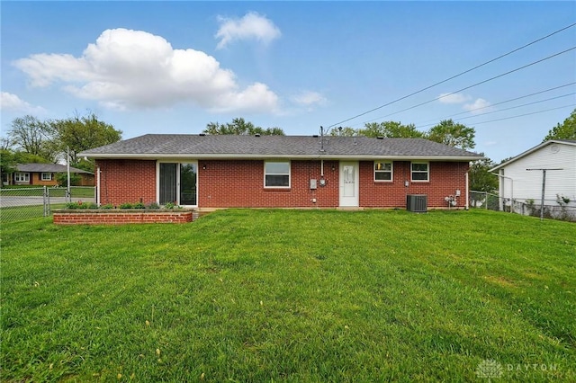 317 Ironwood Dr, West Carrollton, OH 45449 - rear view of house featuring cooling unit and brick siding