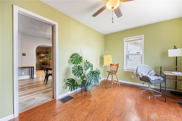 19 Klee Ave, Dayton, OH 45403 - living area with arched walkways, wood finished floors, and ceiling fan