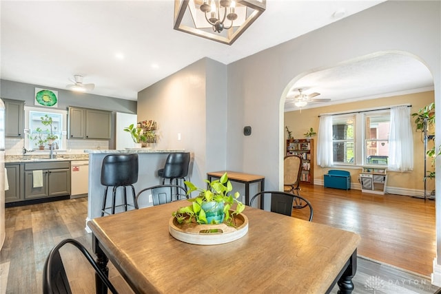 19 Klee Ave, Dayton, OH 45403 - dining space with arched walkways, a ceiling fan, wood finished floors, recessed lighting, and a chandelier