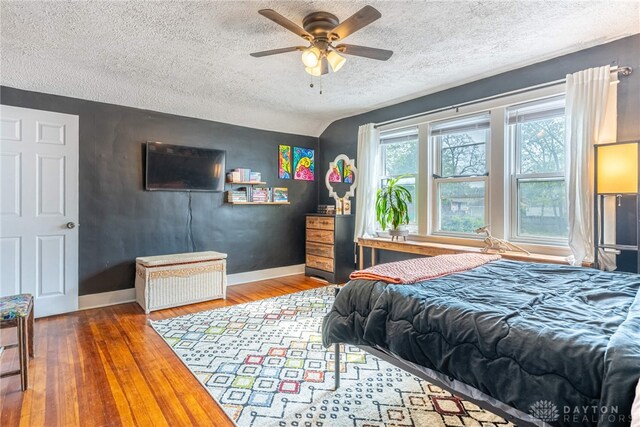 19 Klee Ave, Dayton, OH 45403 - bedroom with wood finished floors, a textured ceiling, and a ceiling fan