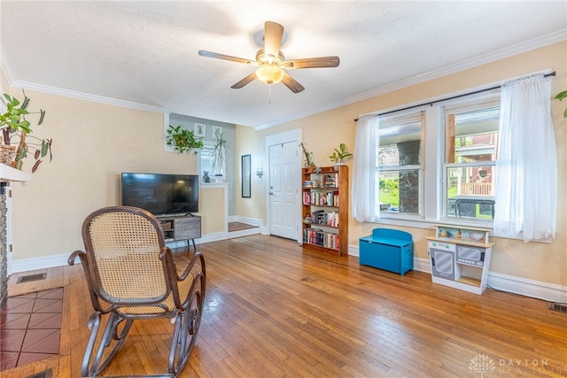 19 Klee Ave, Dayton, OH 45403 - living area with hardwood / wood-style flooring, ceiling fan, and crown molding
