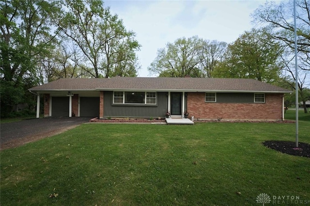 403 W Rahn Rd, Dayton, OH 45429 - single story home with brick siding, driveway, a front yard, and a garage