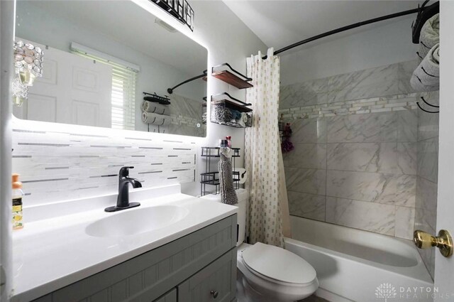 403 W Rahn Rd, Dayton, OH 45429 - full bathroom with vanity, decorative backsplash, shower / bath combination with curtain, and toilet