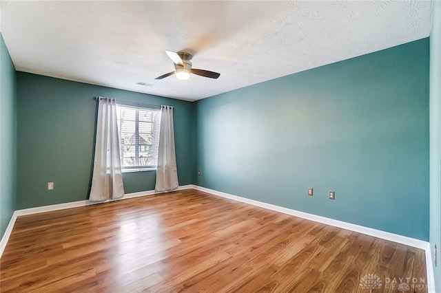 3087 Westminster Dr Unit 101, Beavercreek, OH 45431 - unfurnished room featuring baseboards, ceiling fan, wood finished floors, and visible vents