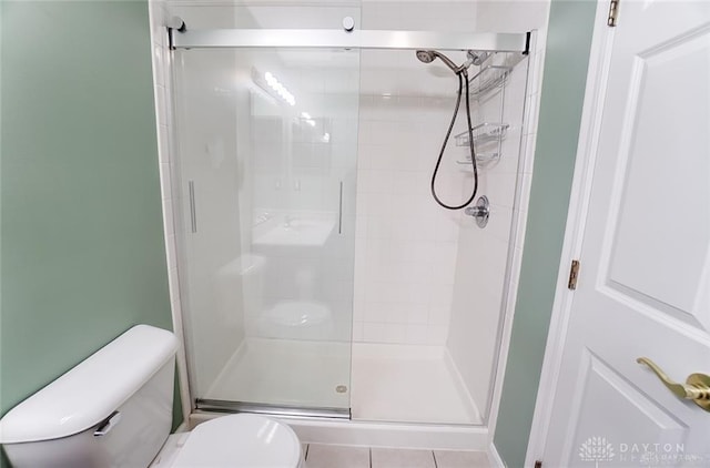 3087 Westminster Dr Unit 101, Beavercreek, OH 45431 - bathroom with tile patterned flooring, toilet, and a shower stall