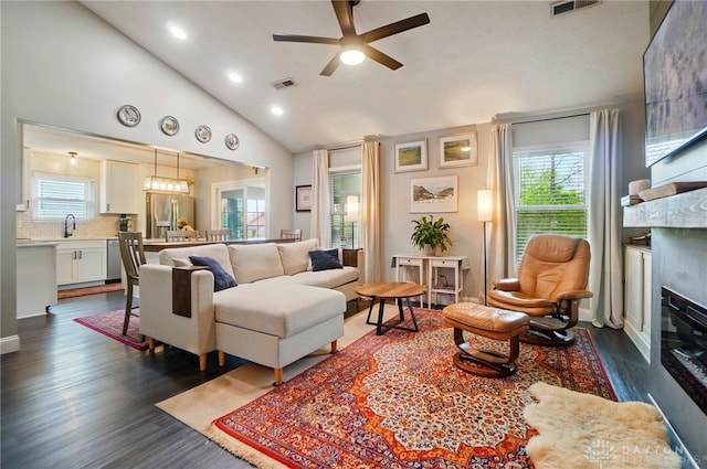2481 Byers Ridge Dr, Miamisburg, OH 45342 - living room with visible vents, a ceiling fan, dark wood-type flooring, and a wealth of natural light