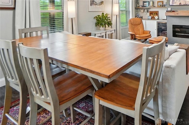 2481 Byers Ridge Dr, Miamisburg, OH 45342 - dining room featuring a glass covered fireplace and beverage cooler