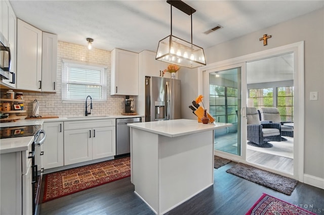 2481 Byers Ridge Dr, Miamisburg, OH 45342 - kitchen with backsplash, stainless steel appliances, dark wood finished floors, and a sink