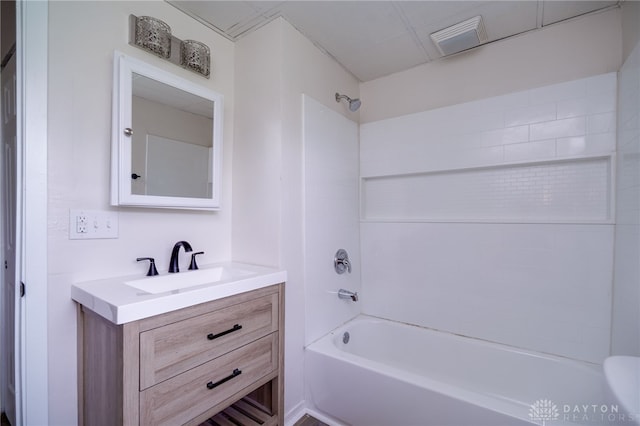 full bathroom with  shower combination, visible vents, and vanity