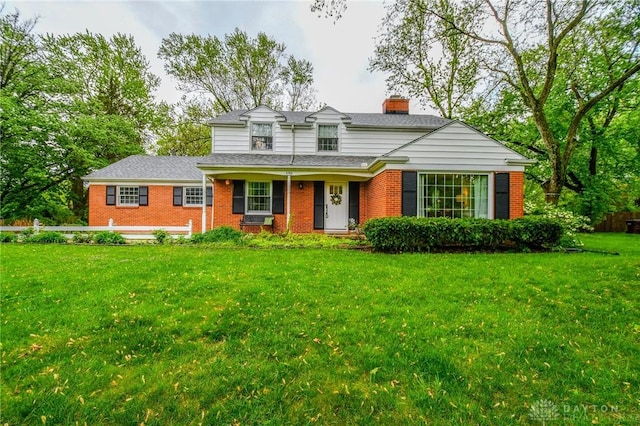 5788 Folkestone Dr, Dayton, OH 45459 - traditional-style house with a chimney, brick siding, and a front yard