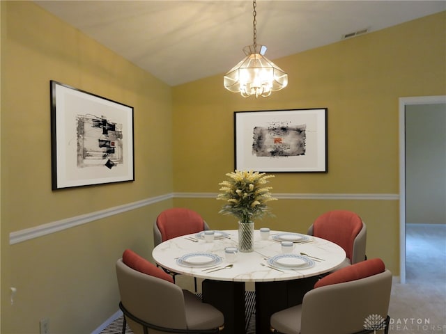 1520 Lake Pointe Way Unit 6, Centerville, OH 45459 - carpeted dining space with an inviting chandelier, baseboards, visible vents, and vaulted ceiling
