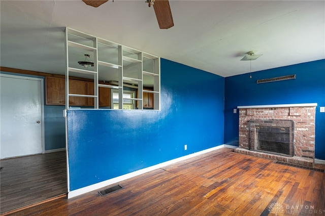 unfurnished living room with baseboards, ceiling fan, and wood finished floors