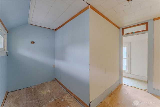spare room with vaulted ceiling
