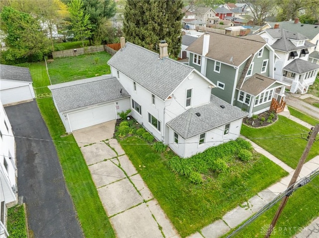 birds eye view of property with a residential view