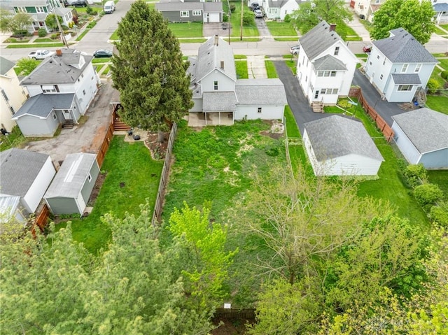 birds eye view of property with a residential view