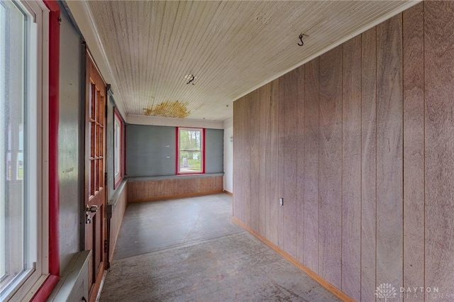 empty room with wooden walls and wooden ceiling