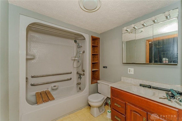 bathroom with tile patterned floors, vanity, toilet, and a textured ceiling