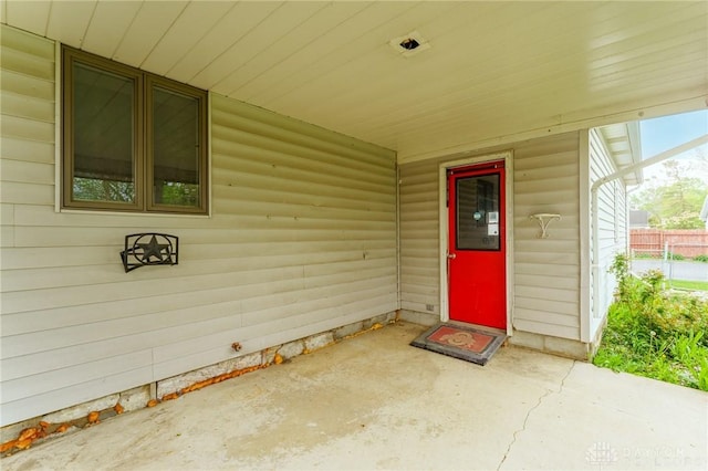 entrance to property with a patio